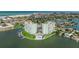 Breathtaking aerial perspective showcasing the waterfront complex, pool area, and stunning coastal views at 400 64Th Ave # 1108, St Pete Beach, FL 33706