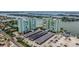 Panoramic aerial view of the waterfront complex, showcasing lush landscaping and desirable amenities at 400 64Th Ave # 1108, St Pete Beach, FL 33706