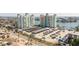 Aerial view of condominium buildings near the bay with boat docks and nearby parking at 400 64Th Ave # 1108, St Pete Beach, FL 33706