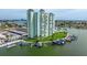 Expansive aerial view highlighting the complex's waterfront location, lush lawns, and convenient boat docks at 400 64Th Ave # 1108, St Pete Beach, FL 33706