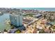 This aerial view showcases the condominium's proximity to the beach, community and surrounding commercial area at 400 64Th Ave # 1108, St Pete Beach, FL 33706