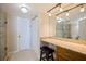 Bathroom with a large mirror, a granite countertop vanity and a stool at 400 64Th Ave # 1108, St Pete Beach, FL 33706