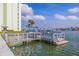 Waterfront dock access with boat mooring, landscaping, and water views at 400 64Th Ave # 1108, St Pete Beach, FL 33706