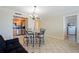 This charming dining area is part of the home's open-concept floor plan and has a lovely tile floor at 400 64Th Ave # 1108, St Pete Beach, FL 33706