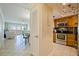 Modern kitchen featuring granite countertops, stainless steel appliances, and adjacent dining area at 400 64Th Ave # 1108, St Pete Beach, FL 33706