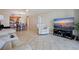 Spacious open floor plan with lovely tile flooring, and an adjacent dining area and kitchen at 400 64Th Ave # 1108, St Pete Beach, FL 33706