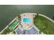 Aerial shot featuring a sparkling pool, poolside loungers, and shuffleboard courts in waterfront complex at 400 64Th Ave # 1108, St Pete Beach, FL 33706