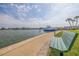 Scenic waterfront view with bench seating overlooking the bay with boats passing by at 400 64Th Ave # 1108, St Pete Beach, FL 33706