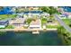 Experience waterfront living with this aerial view of homes boasting private docks, perfect for boaters and water enthusiasts in a serene setting at 4390 6Th Isle Dr, Hernando Beach, FL 34607