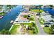 Aerial view of waterfront home with boat dock and trailer parking at 4390 6Th Isle Dr, Hernando Beach, FL 34607