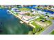 Aerial view of waterfront home with boat dock and trailer parking at 4390 6Th Isle Dr, Hernando Beach, FL 34607