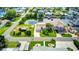 Aerial view of a waterfront community featuring homes with private docks and canals, showcasing the ideal coastal living experience at 4390 6Th Isle Dr, Hernando Beach, FL 34607