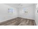 This bedroom features an abundance of natural light and wood-look flooring at 4390 6Th Isle Dr, Hernando Beach, FL 34607