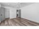 Bright, white bedroom with hardwood floors and two doorways at 4390 6Th Isle Dr, Hernando Beach, FL 34607