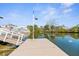 Property features a private dock with easy water access, complemented by a light fixture for evening enjoyment and waterfront living at 4390 6Th Isle Dr, Hernando Beach, FL 34607