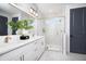 Stylish bathroom features double sinks, a glass-enclosed shower, modern fixtures, and elegant tile work at 4717 W Mccoy St # 18, Tampa, FL 33616