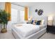 Cozy bedroom showcases contemporary décor, including stylish accents, plush bedding, and natural light from windows at 4717 W Mccoy St # 18, Tampa, FL 33616