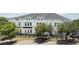 Charming townhome with a manicured lawn and black aluminum fence surrounding the property at 4717 W Mccoy St # 18, Tampa, FL 33616