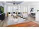Bright living room with large windows, modern decor, a comfortable seating area, and stylish accents at 4717 W Mccoy St # 18, Tampa, FL 33616