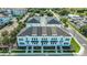Aerial view of a modern townhouse community with neatly arranged buildings and lush greenery at 4717 W Mccoy St # 9, Tampa, FL 33616