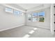 Spacious bedroom bathed in natural light from multiple windows and a tray ceiling at 4717 W Mccoy St # 9, Tampa, FL 33616