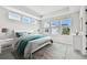 Bright bedroom with tray ceiling, and large windows overlooking the property at 4717 W Mccoy St # 9, Tampa, FL 33616