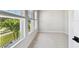 Bedroom with carpet and light-colored walls features windows providing ample natural light at 4717 W Mccoy St # 9, Tampa, FL 33616