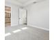 Spacious bedroom with neutral carpet, white walls, tray ceiling and bright windows providing ample natural light at 4717 W Mccoy St # 9, Tampa, FL 33616