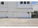 Townhome features a white garage with an 'Available' sign on the side, adding to its appeal at 4717 W Mccoy St # 9, Tampa, FL 33616
