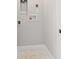 Functional laundry room area with tile flooring and connections for washer and dryer hookups at 4717 W Mccoy St # 9, Tampa, FL 33616