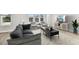 Cozy living room features neutral tones, comfortable seating, and ample natural light at 4717 W Mccoy St # 9, Tampa, FL 33616