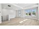 Spacious living room features large windows for natural light and wood look floors at 4717 W Mccoy St # 9, Tampa, FL 33616