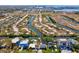 Stunning aerial view of waterfront property with canal access and expansive city skyline backdrop at 4834 W Flamingo Rd, Tampa, FL 33611