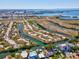Aerial view showcasing the coastal setting of the neighborhood, nearby waterways, and community at 4834 W Flamingo Rd, Tampa, FL 33611
