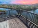 Scenic canal view from a wooden deck, perfect for enjoying waterfront sunsets and outdoor relaxation at 4834 W Flamingo Rd, Tampa, FL 33611