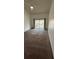 Neutral carpeted living room with natural light from sliding doors to balcony and fan overhead at 4983 Puritan Cir # 524, Tampa, FL 33617