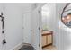 This powder room features a modern vanity and decorative mirror, conveniently located near the entrance at 5100 Burchette Rd # 1606, Tampa, FL 33647