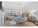 Comfortable bedroom with a mirrored nightstand, window seat and ceiling fan at 5100 Burchette Rd # 1606, Tampa, FL 33647