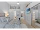 Bright bedroom with a mirrored closet door, TV, ceiling fan and access to the bathroom at 5100 Burchette Rd # 1606, Tampa, FL 33647