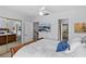 Bright bedroom with a sliding closet door, TV, ceiling fan and light blue walls at 5100 Burchette Rd # 1606, Tampa, FL 33647
