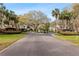 Gated entrance to the Faircrest community, featuring lush landscaping at 5100 Burchette Rd # 1606, Tampa, FL 33647