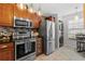 Modern kitchen featuring stainless steel appliances, granite countertops, and tile backsplash at 5100 Burchette Rd # 1606, Tampa, FL 33647