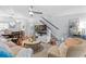 This spacious living room boasts ample natural light, open to dining area, and features a staircase at 5100 Burchette Rd # 1606, Tampa, FL 33647
