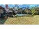 Expansive backyard featuring a screened-in pool, offering an ideal space for outdoor entertaining at 5101 Estates Cir, Sarasota, FL 34243