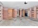 Unfinished basement features concrete floors, shelving, and open space for storage at 5101 Estates Cir, Sarasota, FL 34243