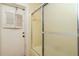 Bathroom featuring a glass door shower and door to the exterior at 5101 Estates Cir, Sarasota, FL 34243