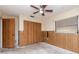 A bedroom with a ceiling fan, closet, and a window providing natural light at 5101 Estates Cir, Sarasota, FL 34243