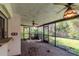 A spacious screened-in patio with ceiling fans for relaxed indoor-outdoor living at 5101 Estates Cir, Sarasota, FL 34243