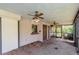 A cozy covered patio with a ceiling fan offers a relaxing outdoor space at 5101 Estates Cir, Sarasota, FL 34243