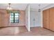 Inviting foyer featuring wood floors, double doors, and a view into the adjacent room at 5101 Estates Cir, Sarasota, FL 34243